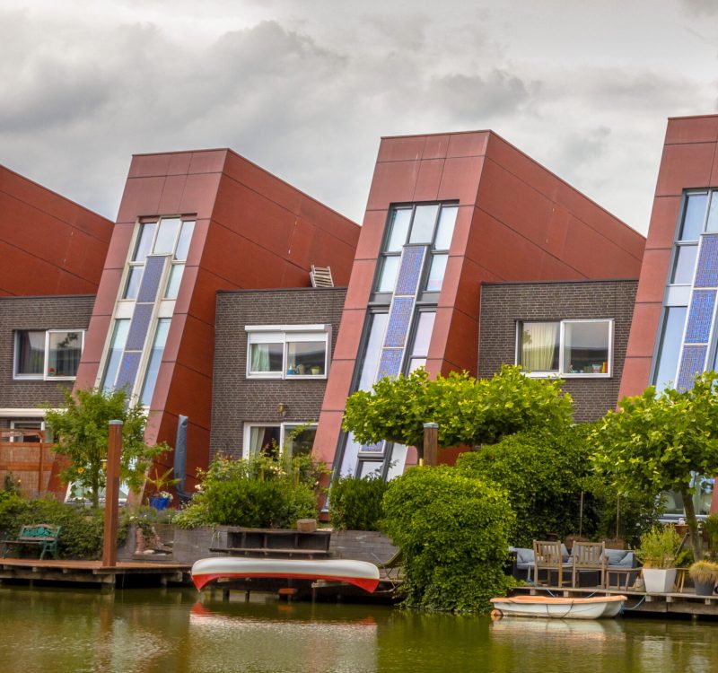 Waterfront houses with integrated solar panels and hanging gardens on waterfront in urban area of The Hague, Netherlands